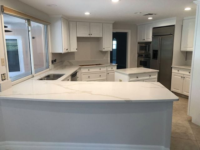 white kitchen cabinets marble counters