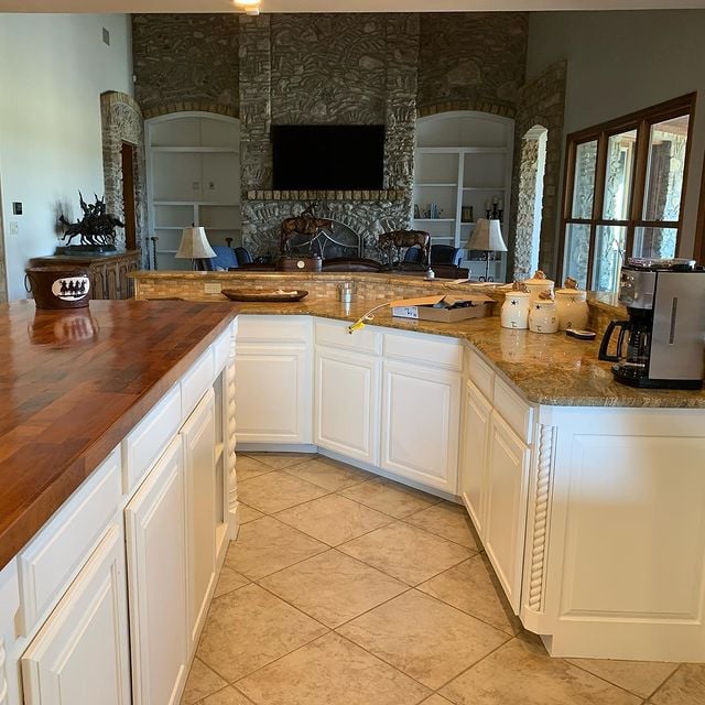 white kitchen cabinets with granite and hardwood counters