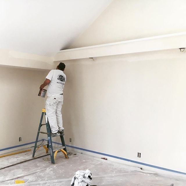 white room being painted by painter