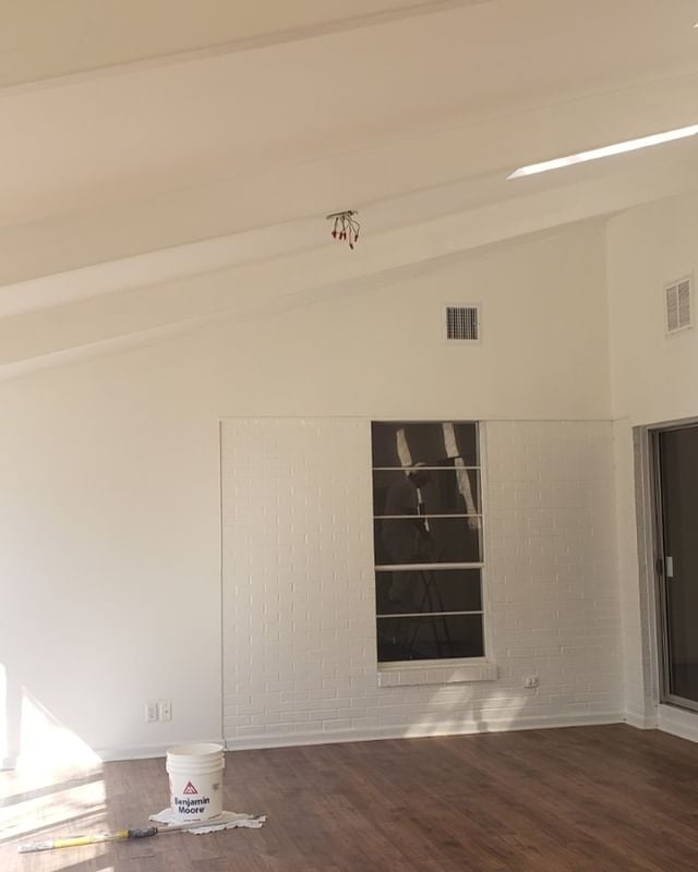 white room with hardwood flooring