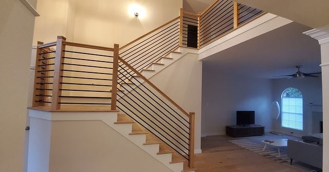 white room with wooden railings