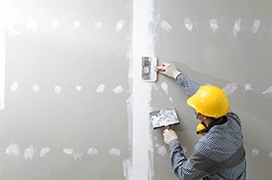 Protect Painters professional repairing drywall.