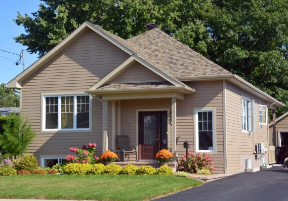 Freshly painted house with vinyl siding.