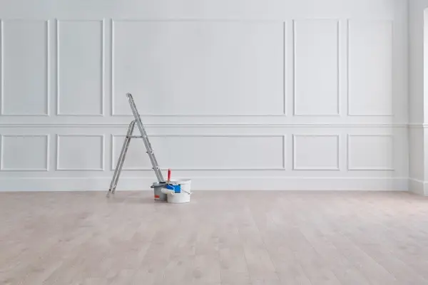 White classic wall paint and brush professional interior painting.