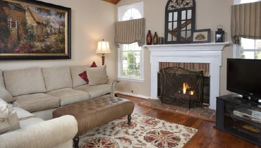 Interior livingroom with beige accents and a fireplace painted by Five Star Painting of Loudoun