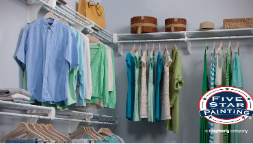 Photo of a closet with several pieces of clothing hanging, Five Star Painting logo on the bottom right