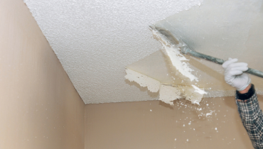 Scraping of popcorn ceiling.