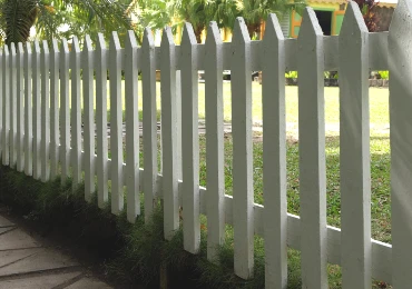 Photo of a white picket fence.