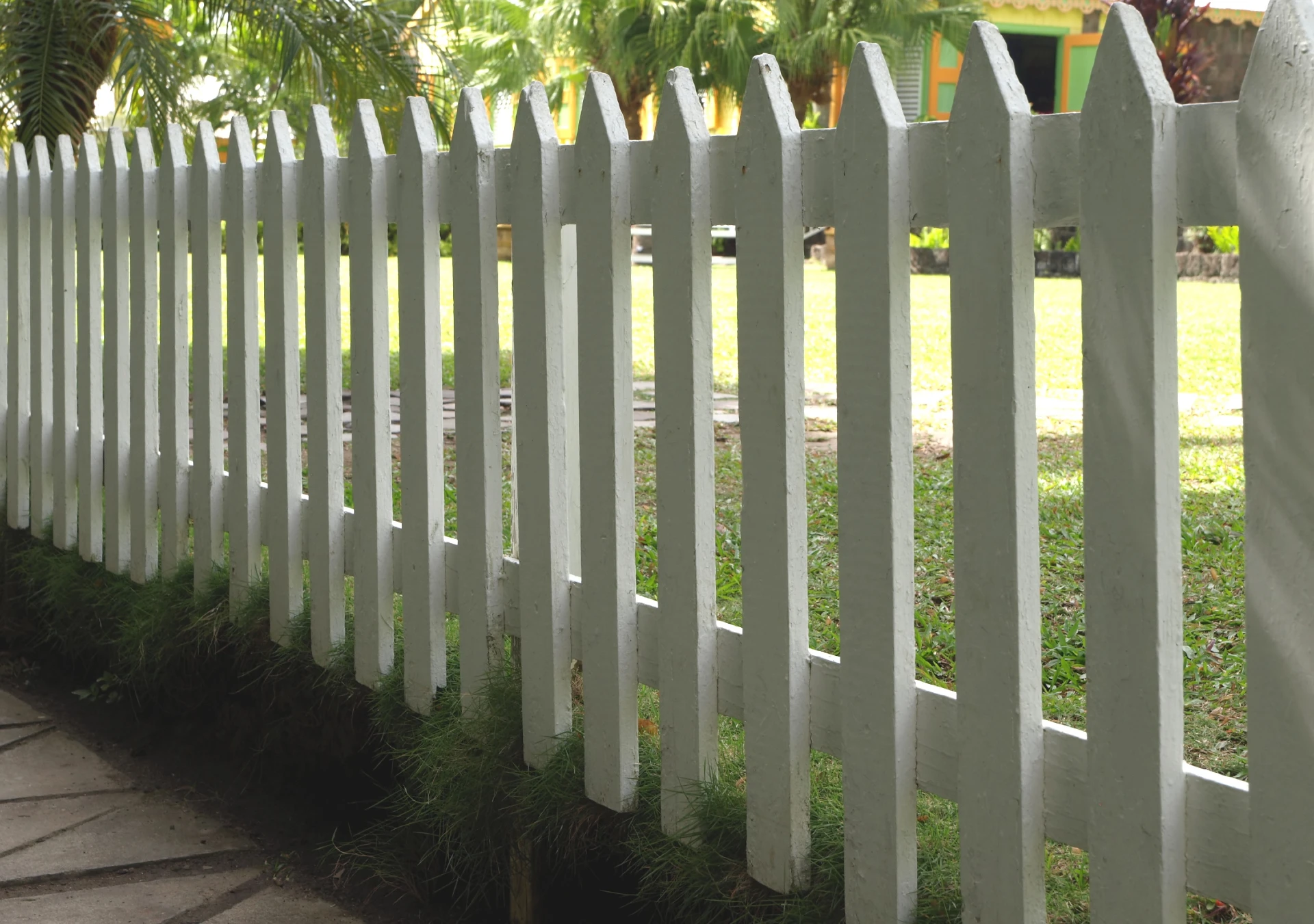 Photo of a white picket fence.