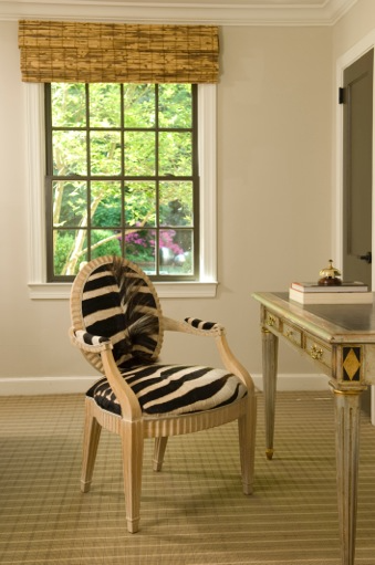 Faux zebra fur upholstered desk chair with neutral wood arms and legs Faux zebra fur upholstered desk chair with neutral wood arms and legs.