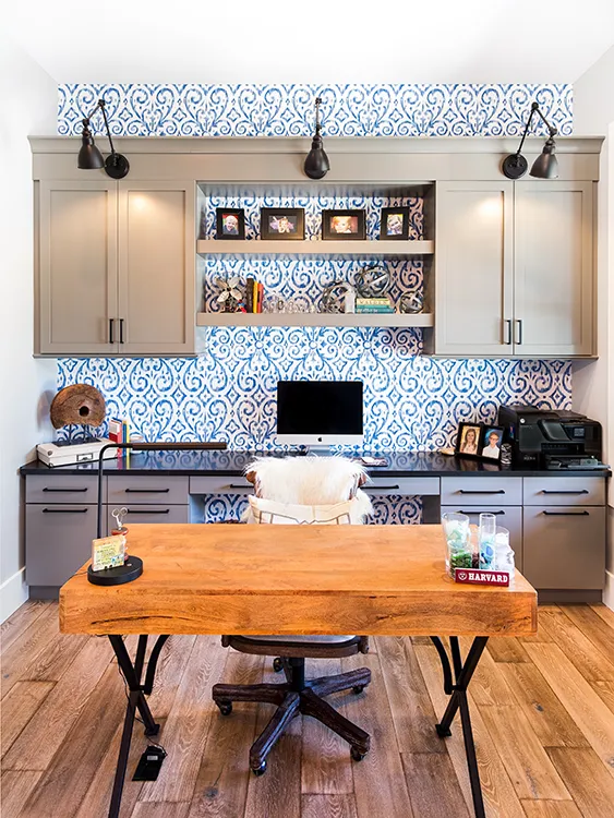 A home office with blue & white wallpaper installed by Five Star Painting