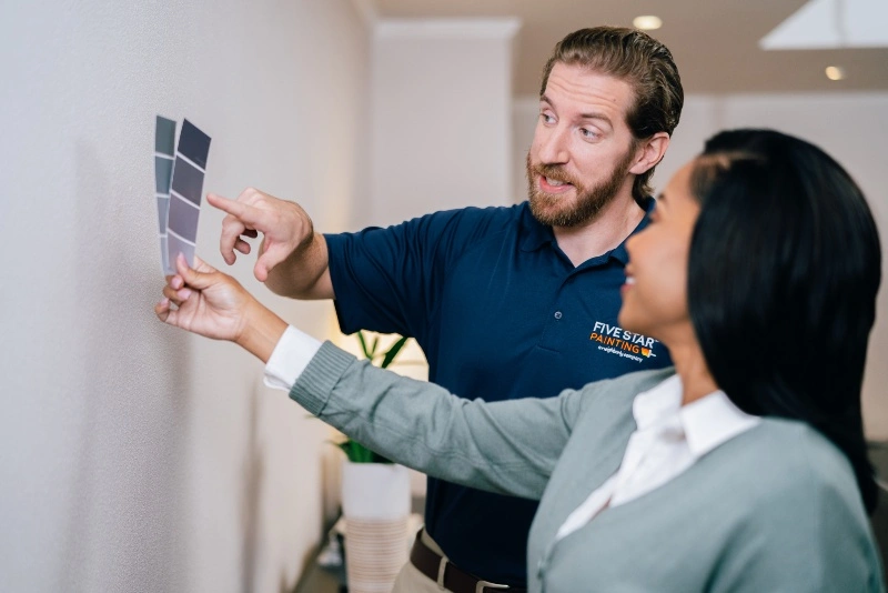 A Five Star Painting estimator assisting a customer during a color consultation 