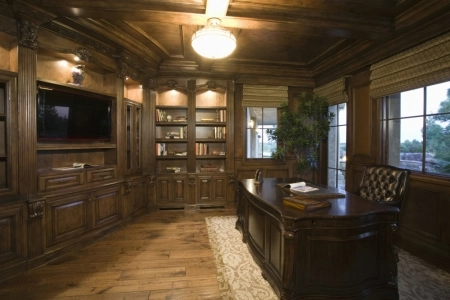 Man Cave Design: The Study Traditional home office with wooden desk and bookshelves.