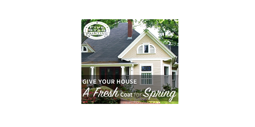 A charming house with a fresh coat of paint, nestled among lush greenery.