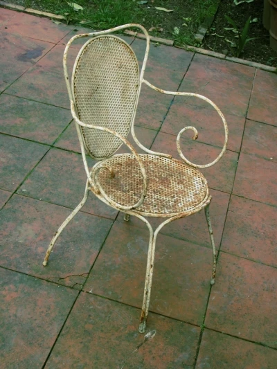 Outdoor Patio Furniture Care: Wrought Iron Rusty iron patio chair