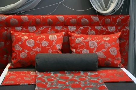 Master bed with Red and Gray Patterned Bedding Master bed with Red and Gray Patterned Bedding