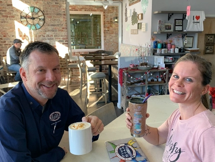 Scott and person eating together.