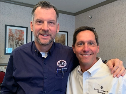 Scott and person in white shirt.