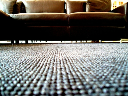 Rec Room Furniture Brown couch on a carpeted floor.