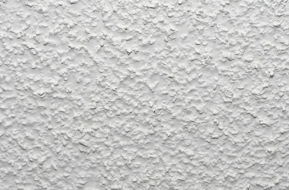 Close-up photo of a popcorn ceiling.