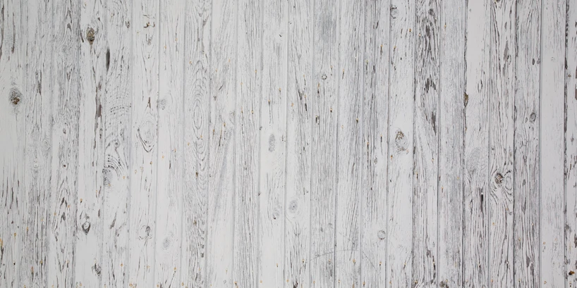 Photo of a wooden platform painted white.