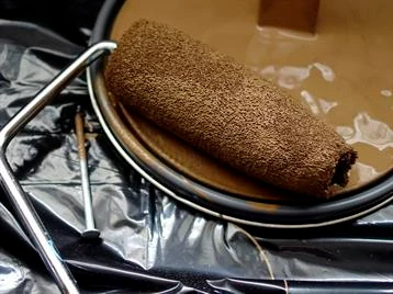 can you stain over painted wood, wood stain vs paint Paint roller in light brown paint.