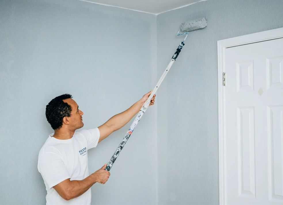 Five Star Painting painter using latex paint to paint drywall.