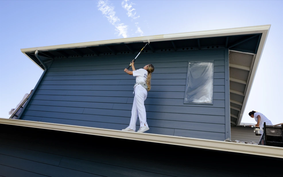 Five Star Painting painting crew using acrylic paint to exterior trim.