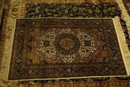 Man Cave Design: Rugs Intricate traditional rug with detailed central medallion and floral motifs.
